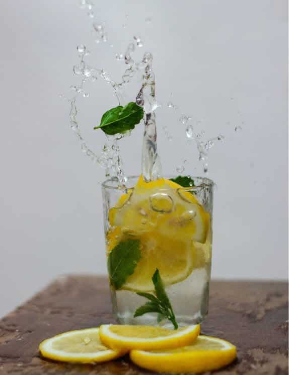 Glass of water and lemons