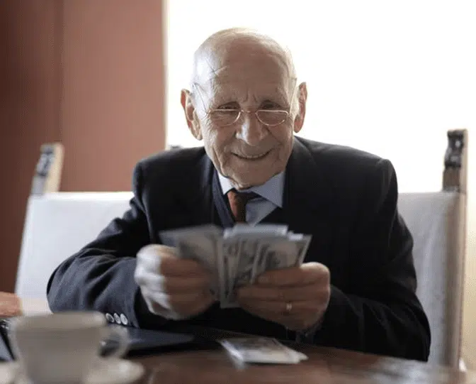 Senior man counting money