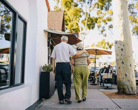 Older couple walking outside