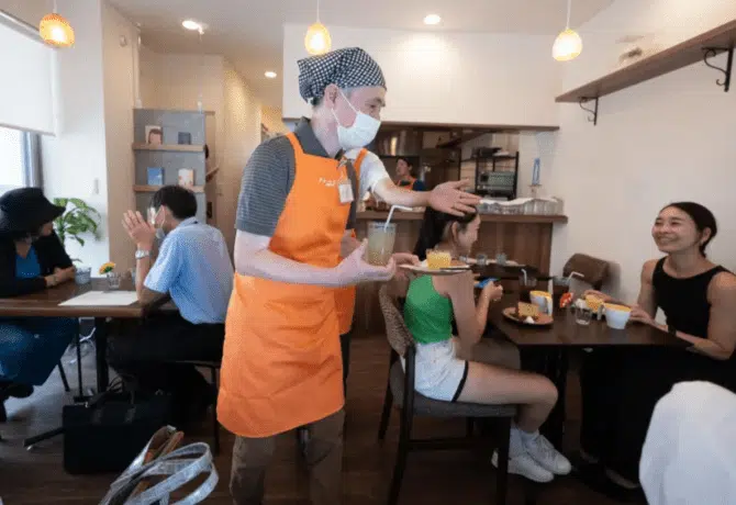 Elderly people with dementia work as servers in Tokyo Cafe
