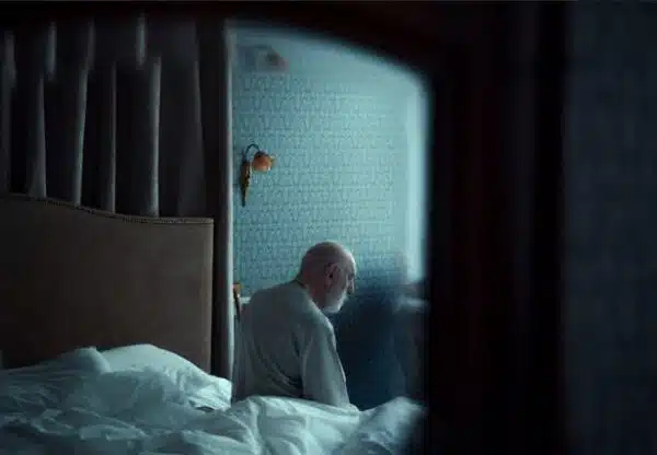 Elderly man in bed