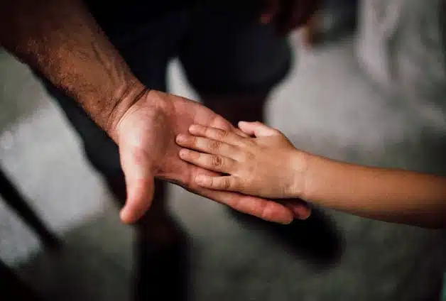 Man and child hands