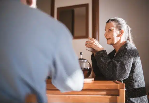 Woman talking to man