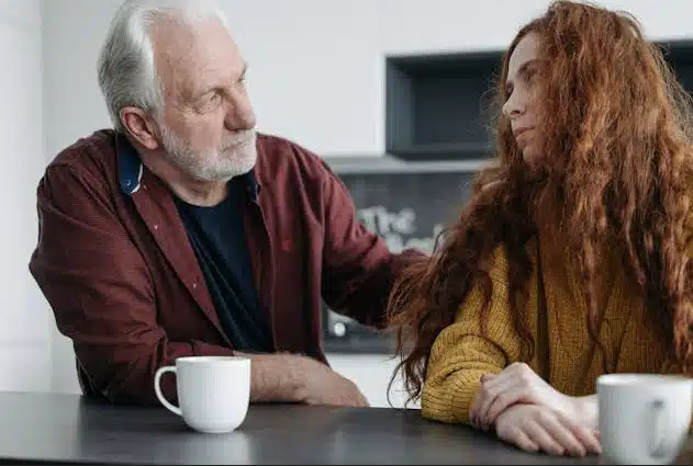 Older man talking to friend