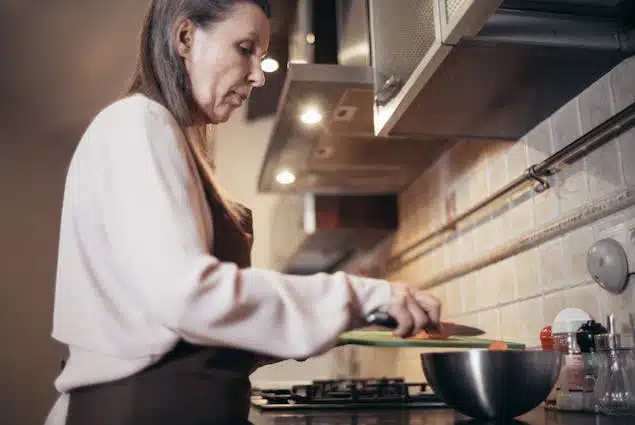 Woman Cooking in Kitchen