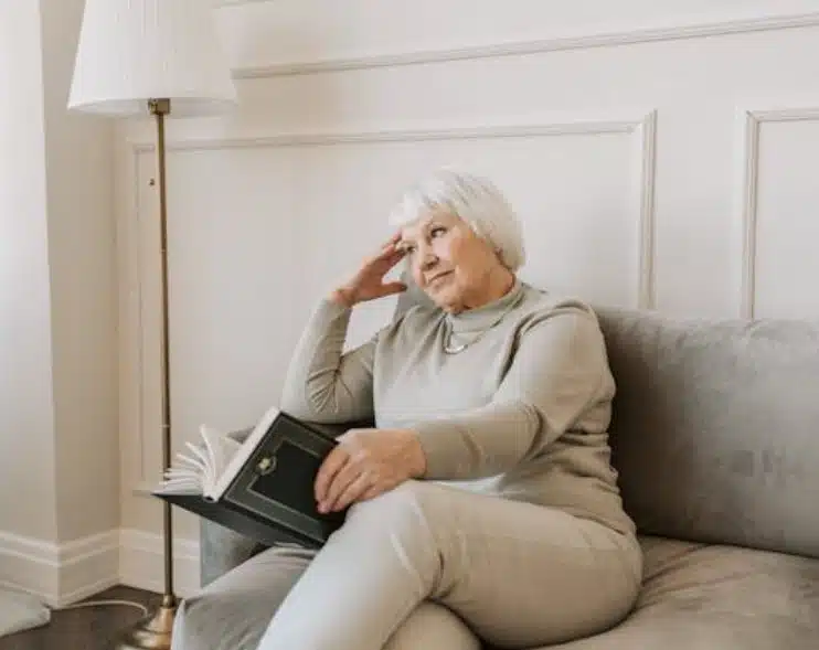 Woman sitting with book